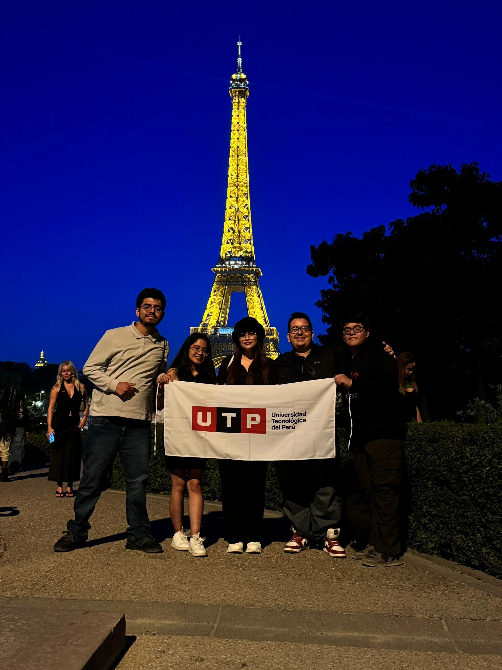 LEAD UTP delegation with the UTP flag in front of the Eiffel Tower, at the RAISE Summit Hackathon, France